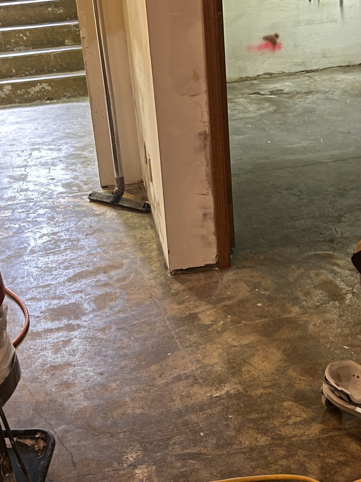 Polished concrete floor reflecting light in a finished room