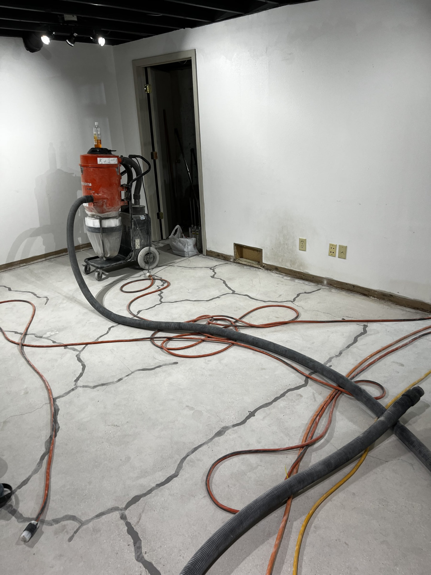 Floor demolition and slab prep before concrete polishing