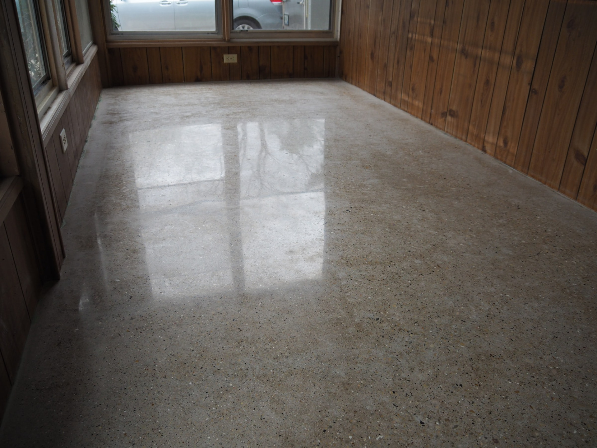 Before and after polished concrete floor transformation on a Wisconsin home porch