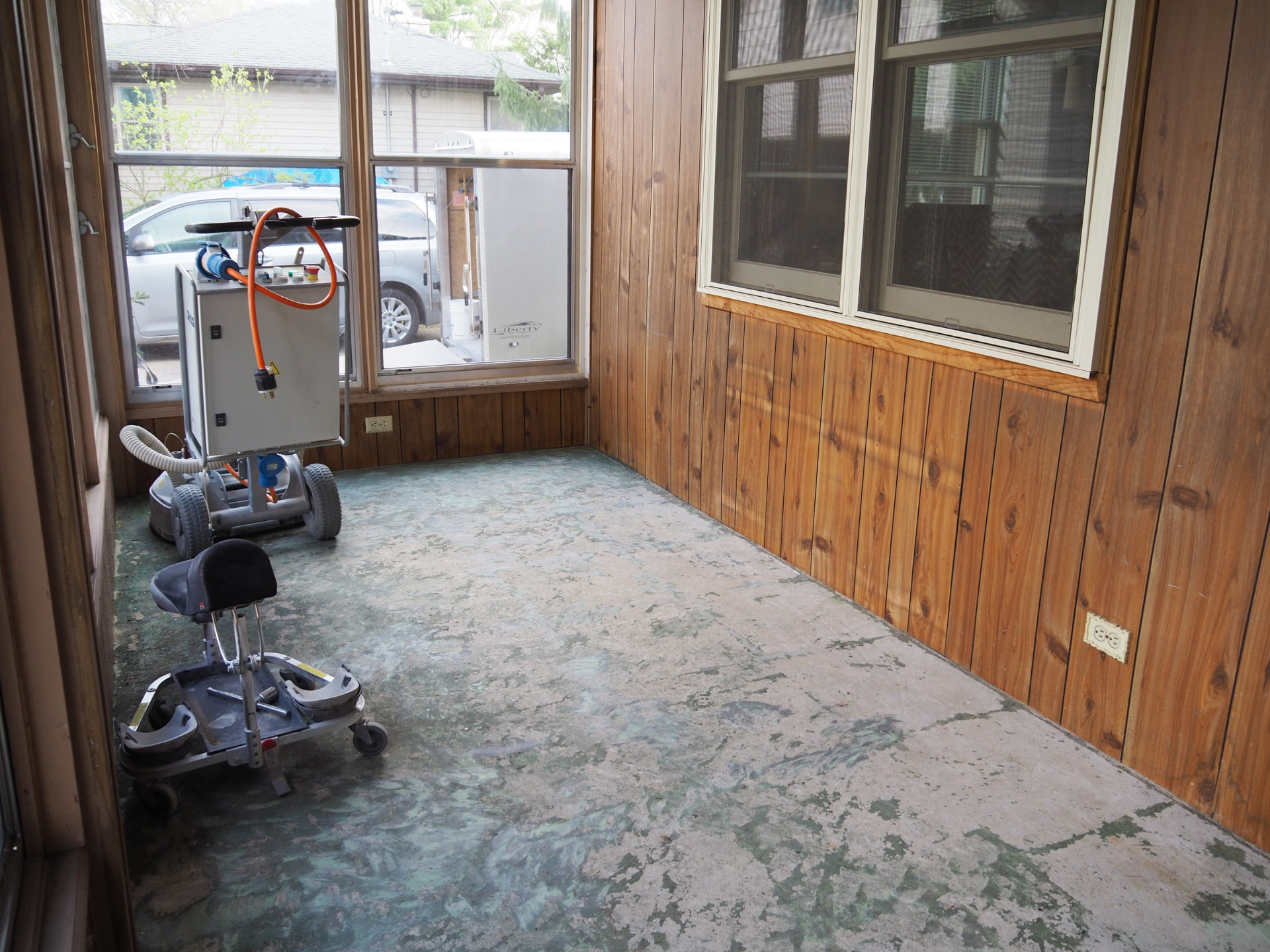 Close-up of worn porch concrete before grinding and polishing