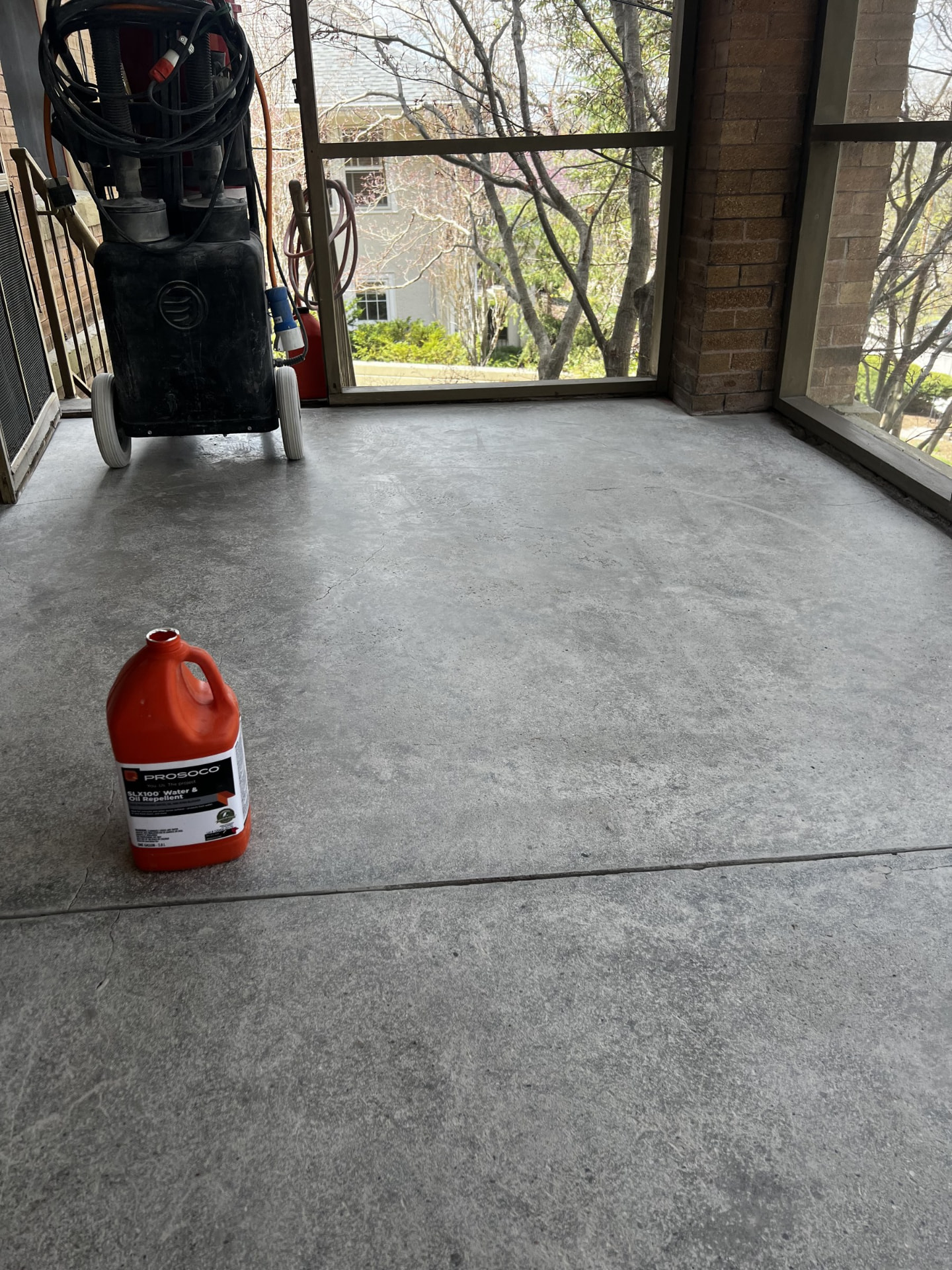Sealer being applied to a freshly polished concrete floor