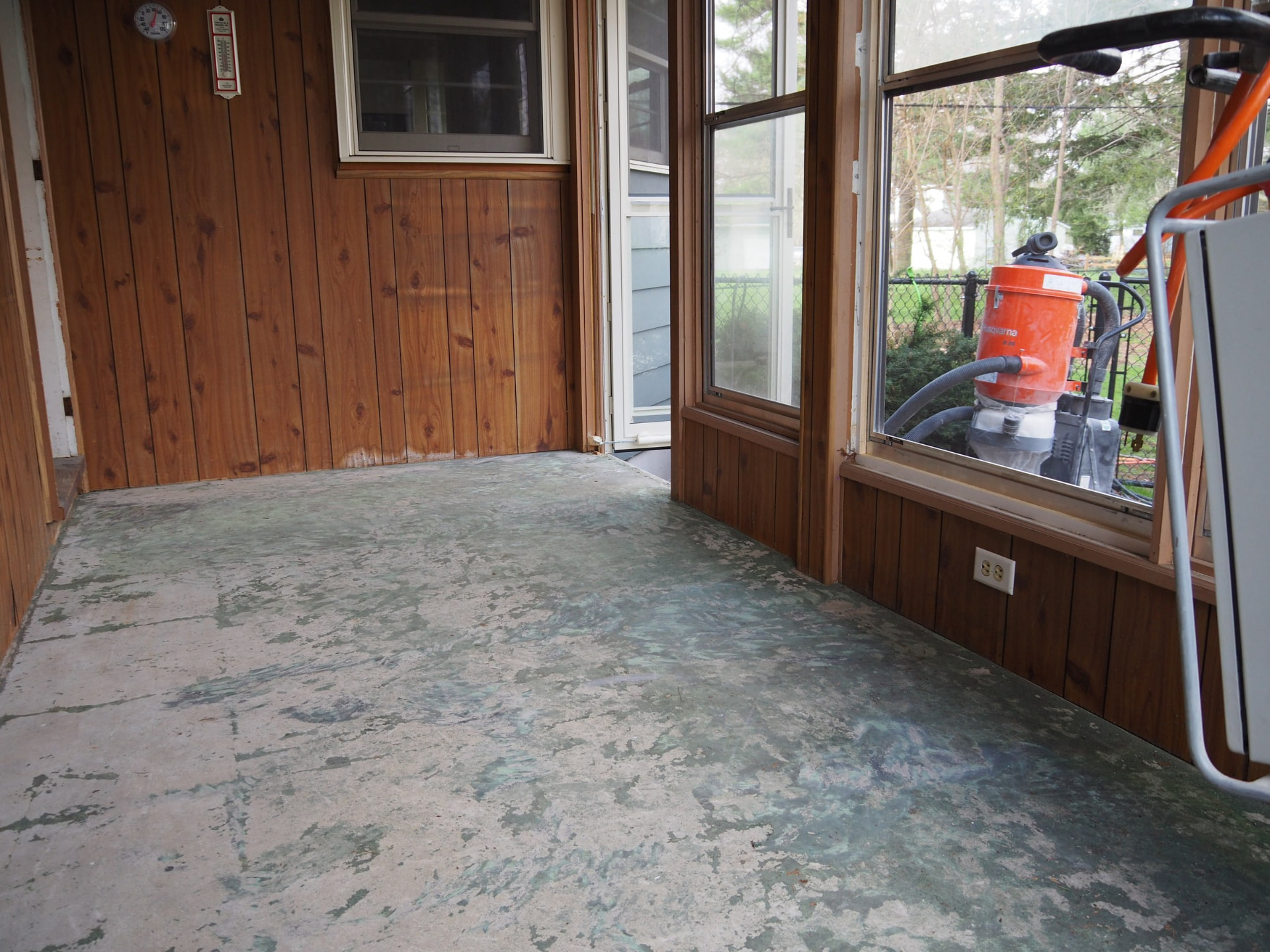 Worn painted porch concrete floor before grinding and polishing